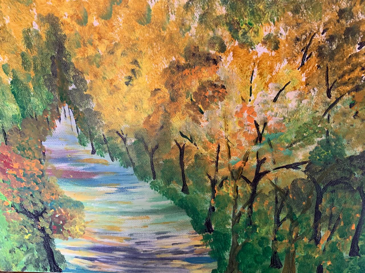 Autumn-toned river path through trees