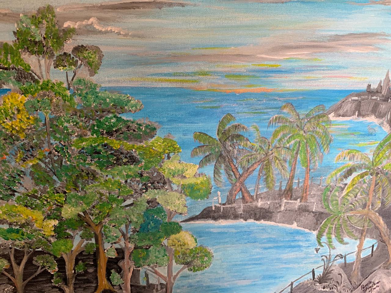 Coastal landscape with palms and water