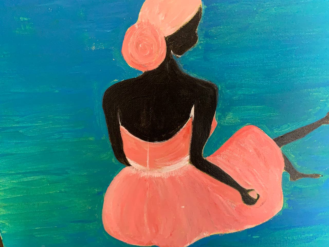 Woman in coral dress against blue background