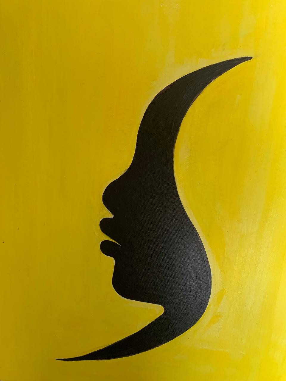 Black profile silhouette on yellow background